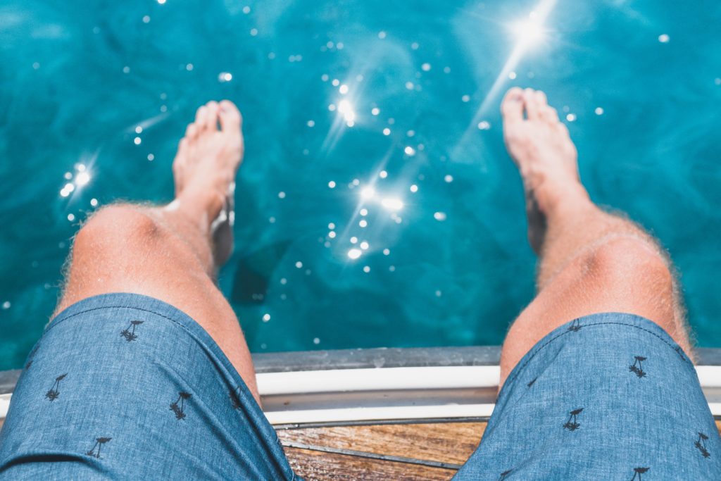 Man sitting by the pool